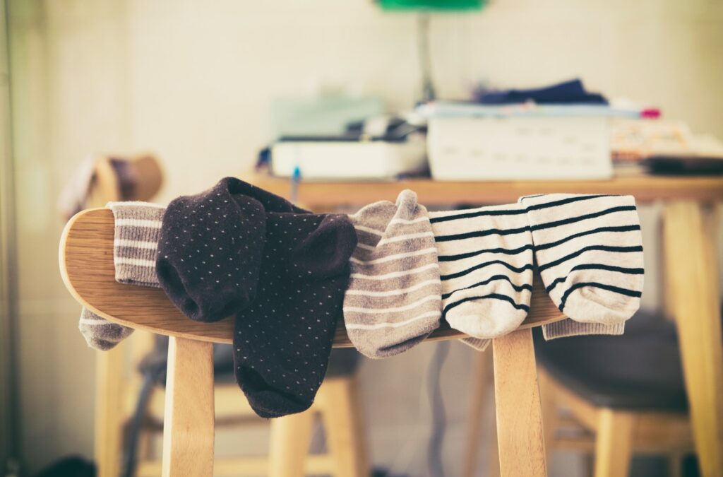 A picture of socks hanging on a chair. This symbolizes setting up a system that can buy back your time.